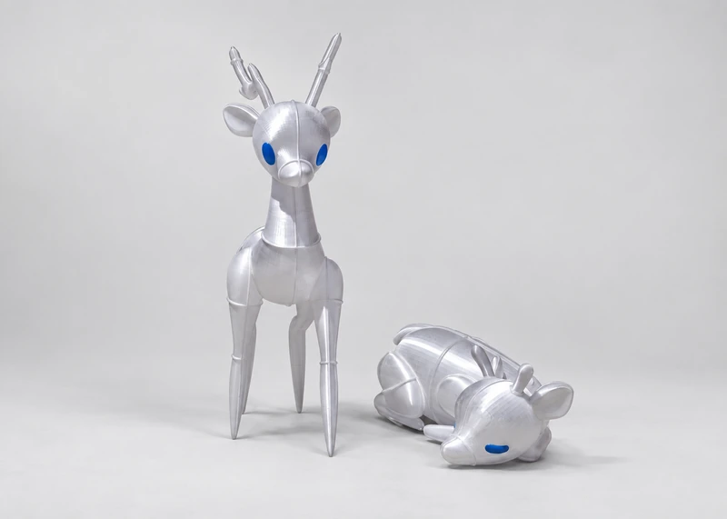 Standing and reclining translucent reindeer forms photographed together